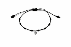 Pulsera SATERRA oro palmera y nylon.